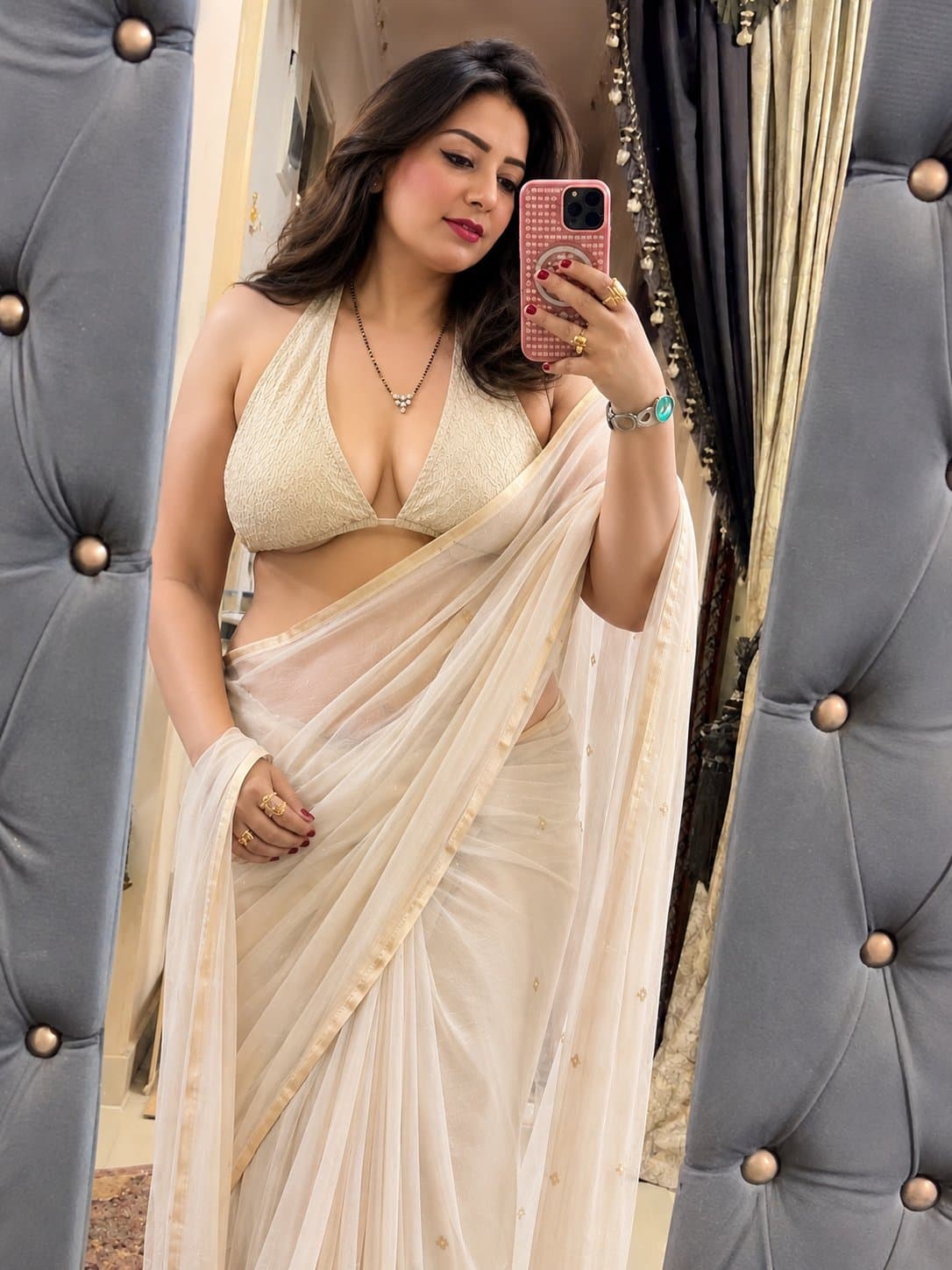 Create a photorealistic editorial-style mirror selfie of an adult Indian woman i