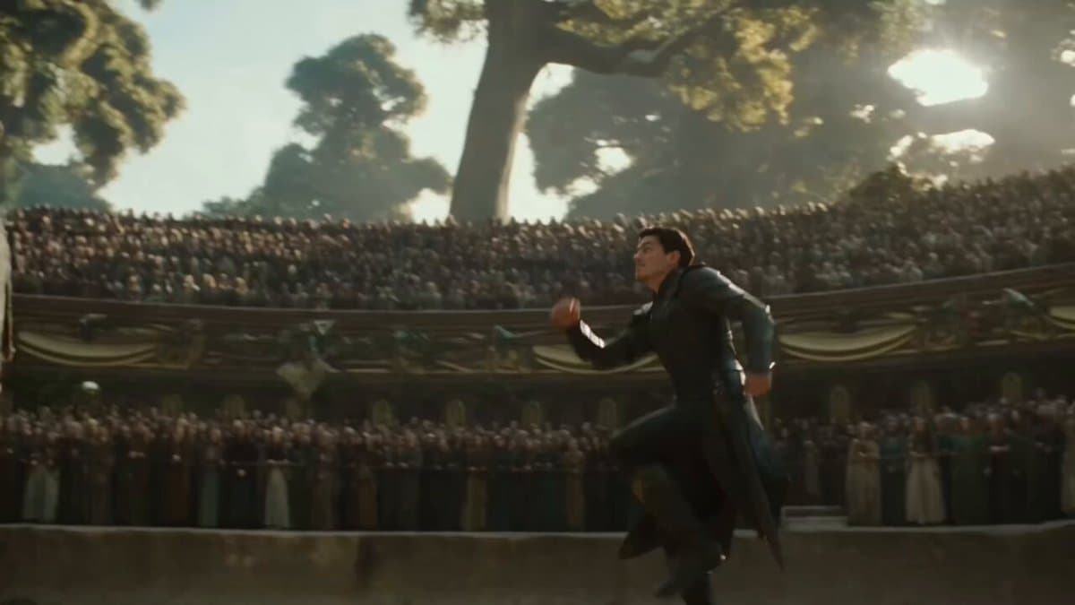 A lone warrior stands before an ancient giant rising from the ruins, surrounded 
